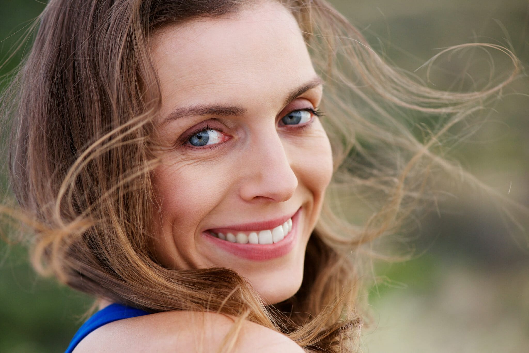 Healthy smiling woman ouatside