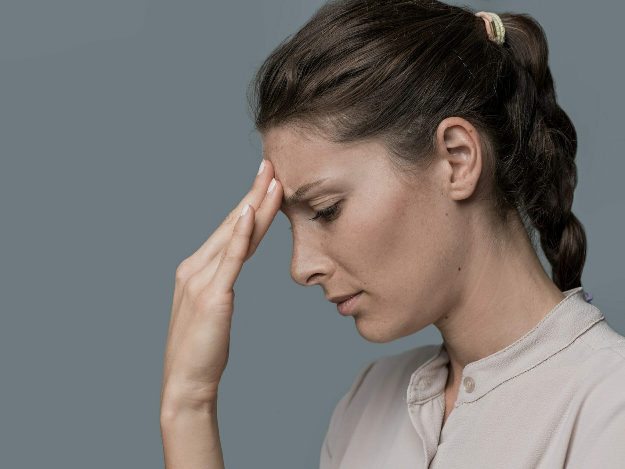 Tired woman with headache