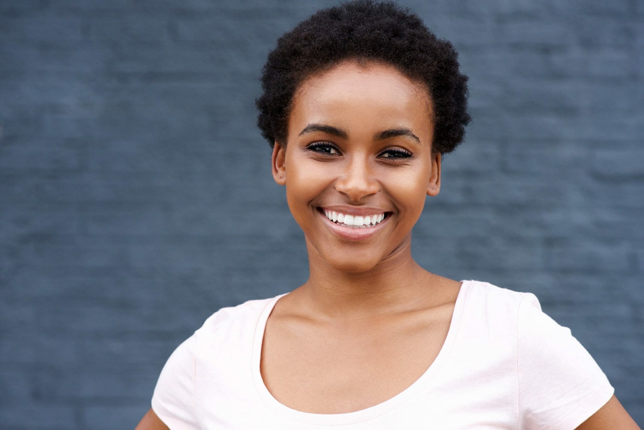 attractive young black woman smiling