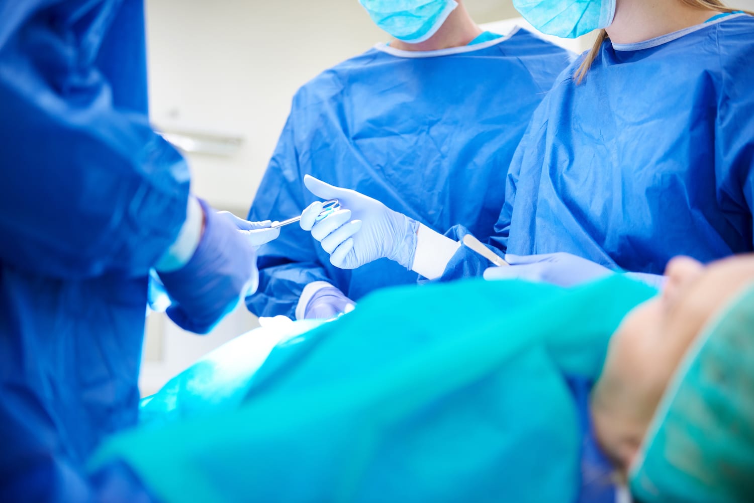 surgery team operating on a patient
