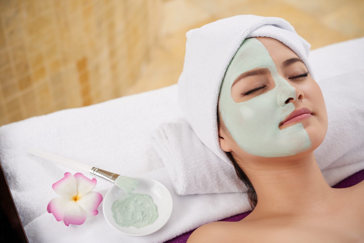 young woman after receiving a face mask at a spa