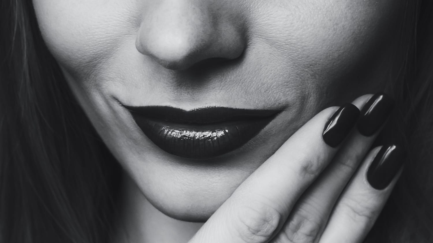 black and white close up of a woman with heavy lipstick
