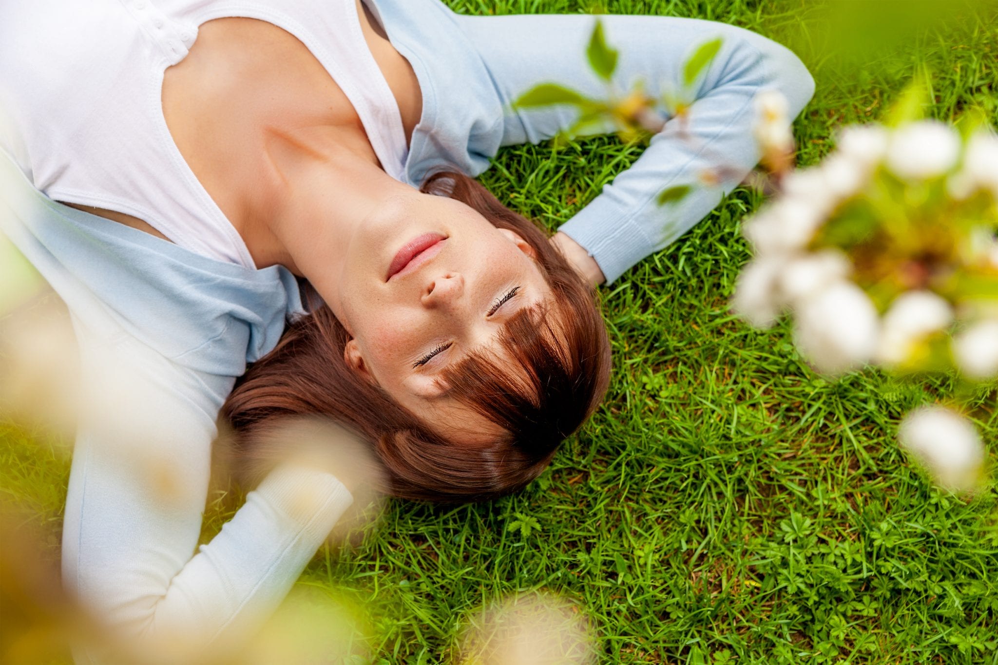 woman laying in the grass