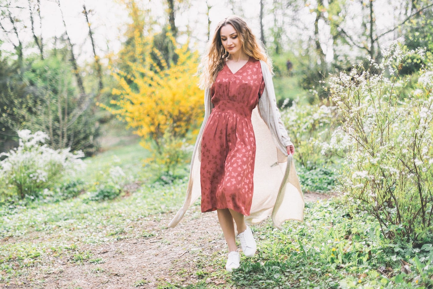 young woman walking through the wilderness