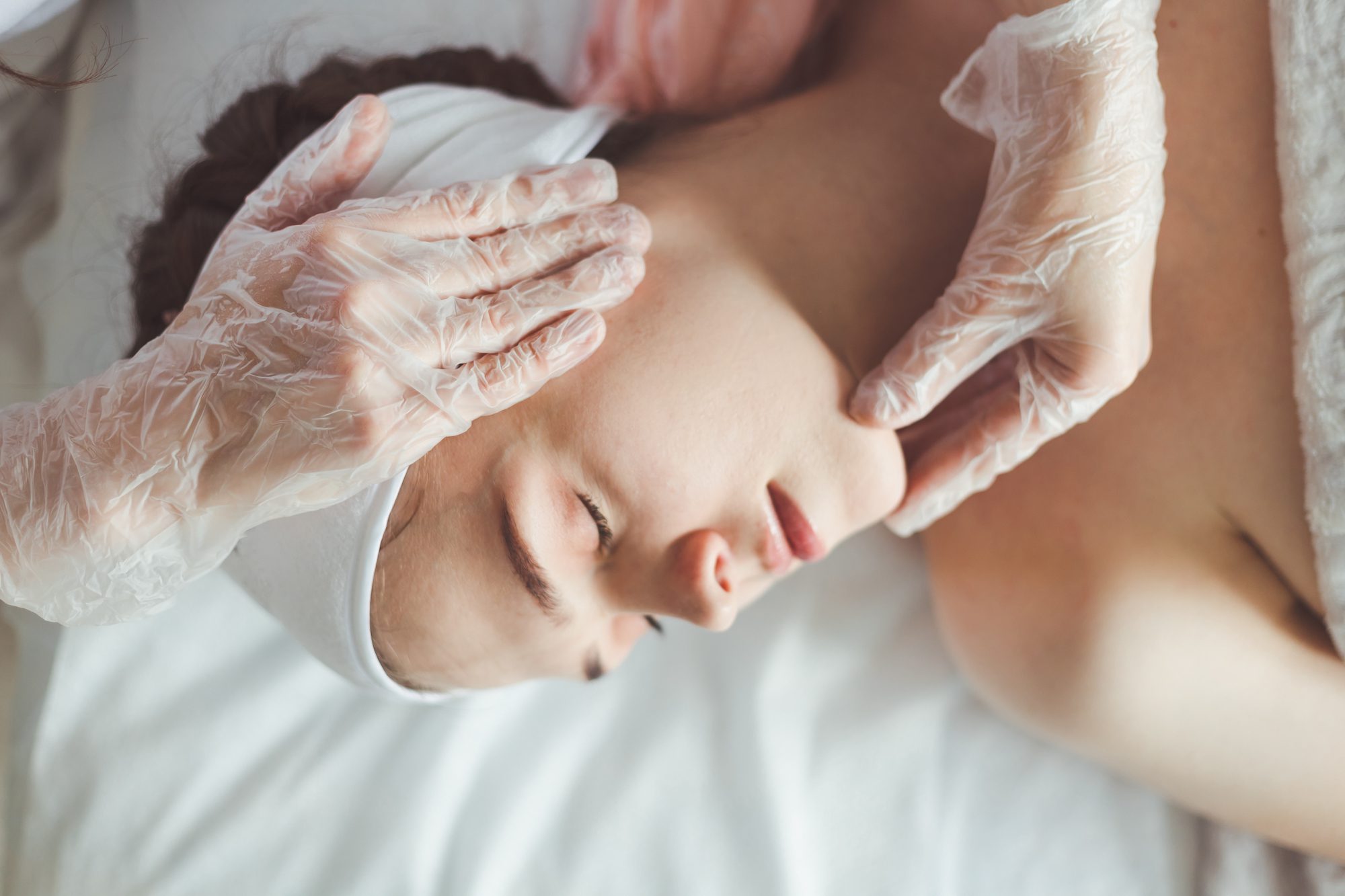 woman receiving facial massage