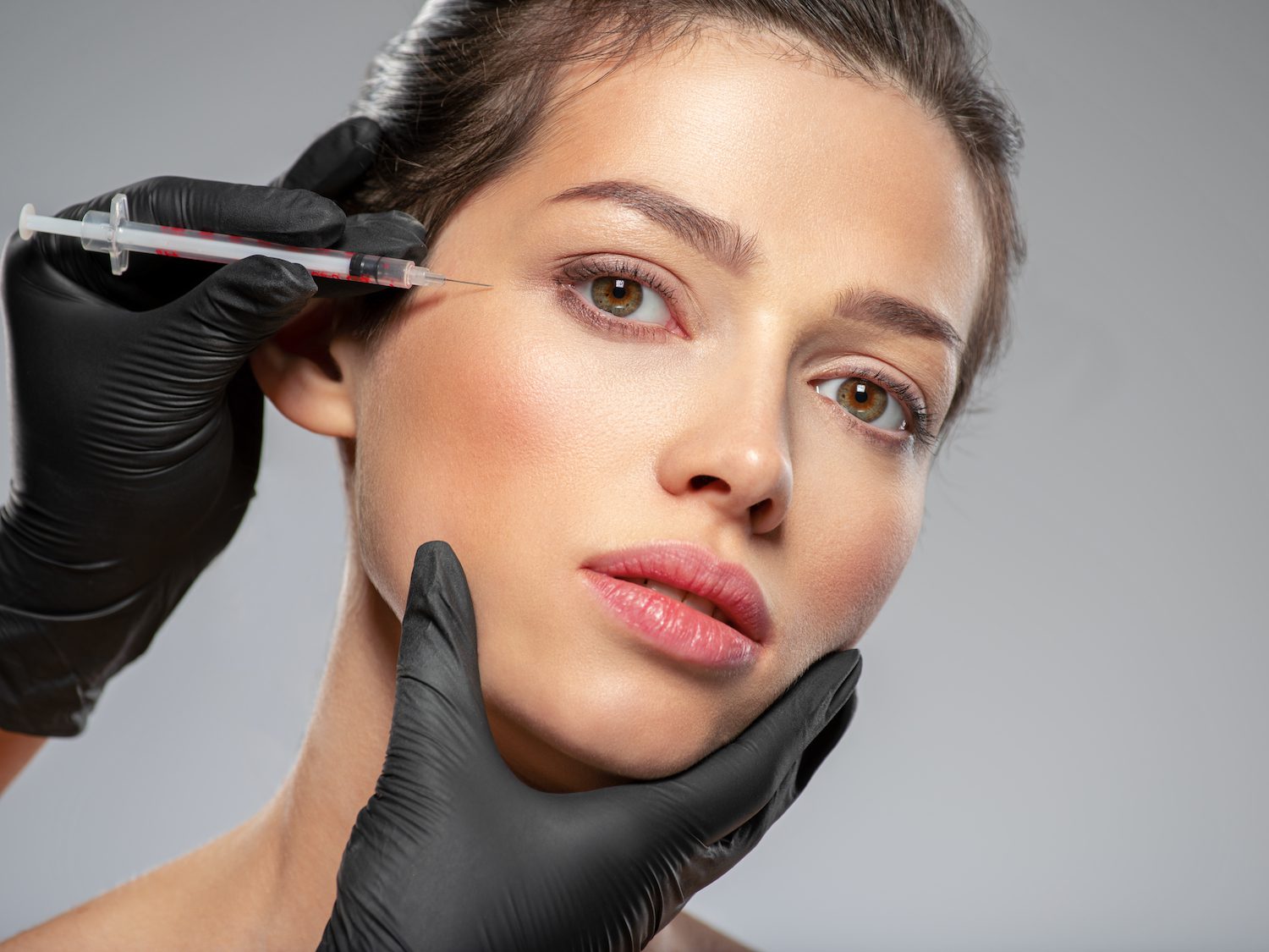 woman receiving facial injection