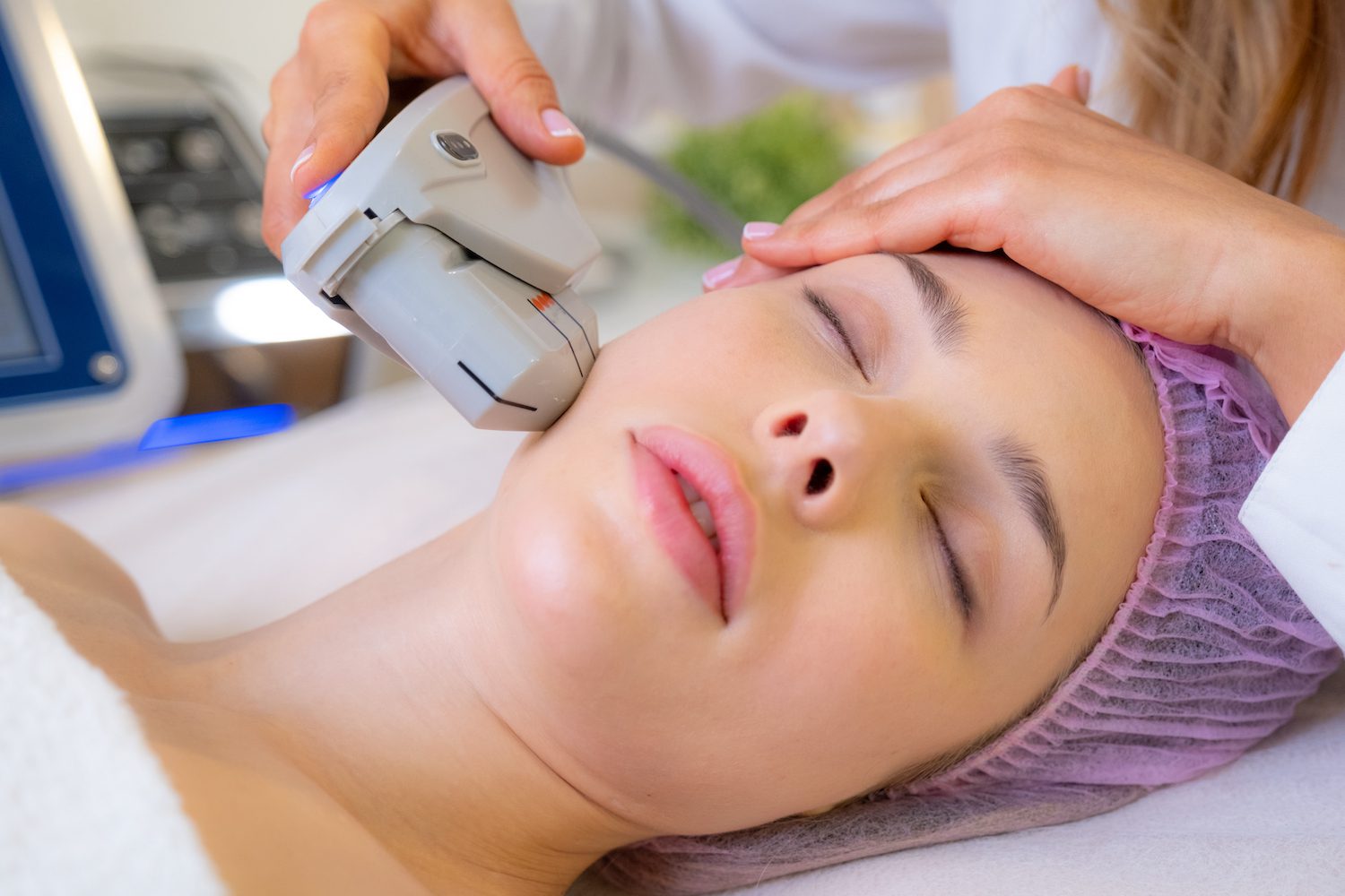 Woman getting facial laser