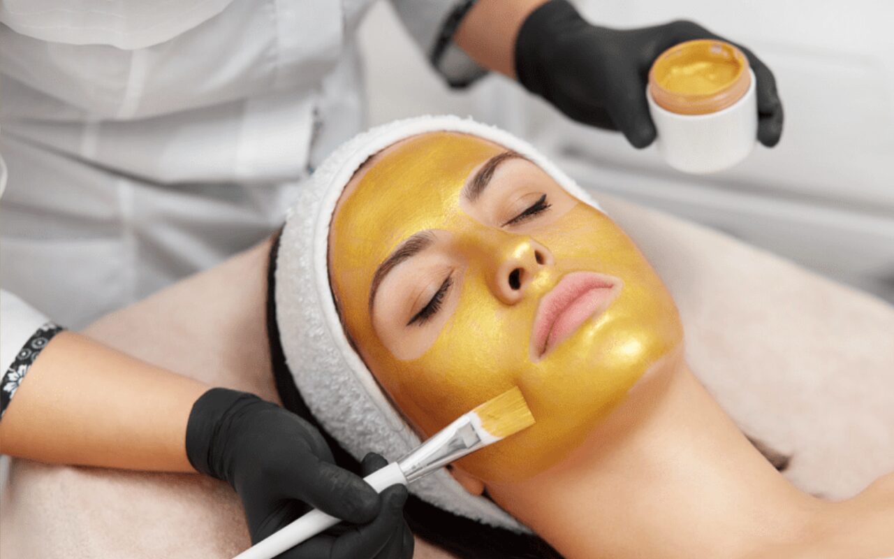 woman with gold glow mask
