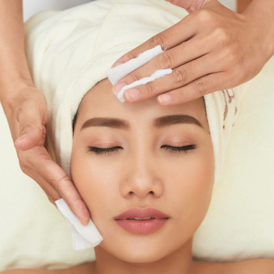 Cleaning Facial Skin beautiful woman having her face cleaned