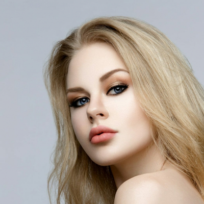 Beautiful girl with blond long hair and makeup