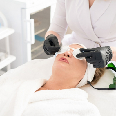 Preparing client for laser surgery Doctor preparing a patient for laser surgery